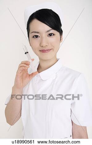 Nurse having a syringe View Large Photo Image Stock Image - Nurse having a syringe. Fotosearch