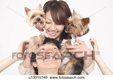 Stock Photo - Couple and dogs. Fotosearch
