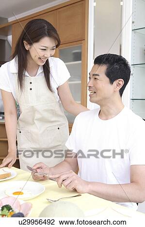 Couple eats a meal View Large Photo Image Stock Image - Couple eats a meal. Fotosearch