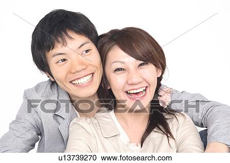 Couple snuggling up to each other View Large Photo Image Stock Image - Couple snuggling up to each other. Fotosearch
