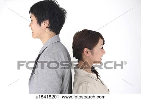 Couple standing back to back View Large Photo Image Stock Image - Couple standing back to back. Fotosearch