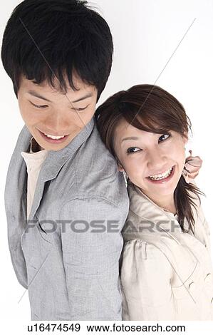 Couple standing back to back View Large Photo Image Stock Photo - Couple standing back to back. Fotosearch