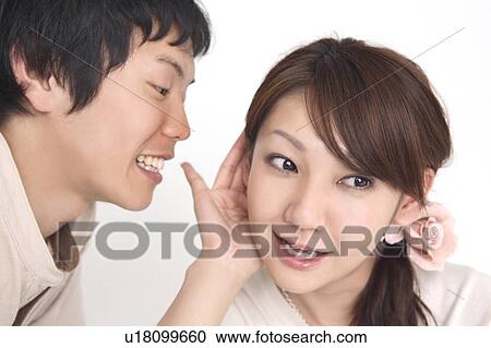Man whispering into an ear of lover View Large Photo Image Stock Image - Man whispering into an ear of lover. Fotosearch