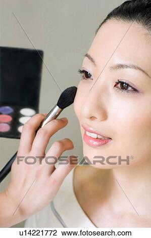 Making up woman View Large Photo Image Stock Image - Making up woman. Fotosearch