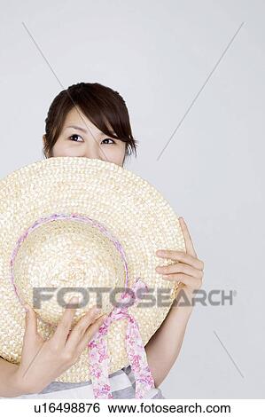 Straw hat and woman View Large Photo Image Stock Photograph - Straw hat and woman. Fotosearch