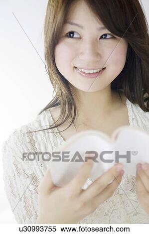 Woman reading a book View Large Photo Image Stock Photography - Woman reading a book. Fotosearch