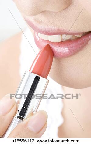 Stock Image - Woman who paints with lipstick. Fotosearch