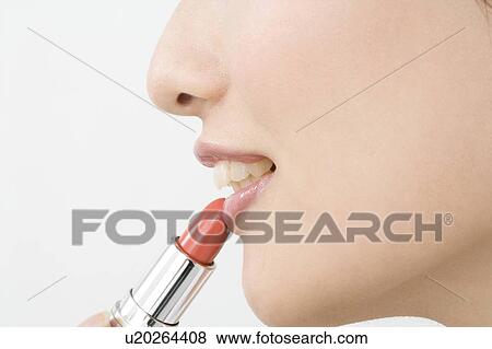 Woman who paints with lipstick View Large Photo Image Stock Photo - Woman who paints with lipstick. Fotosearch