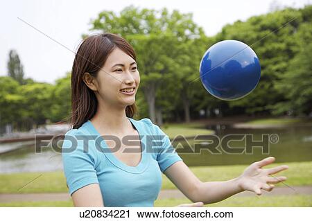 Woman who plays with the ball View Large Photo Image Stock Image - Woman who plays with the ball. Fotosearch