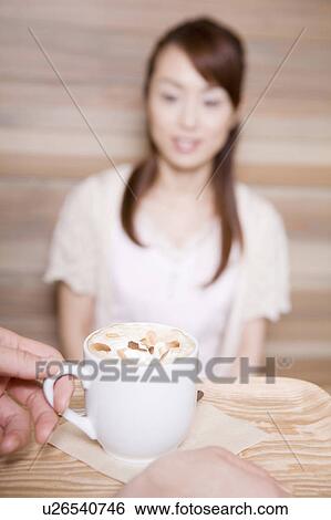 Stock Photograph - Woman who waits for coffee. Fotosearch