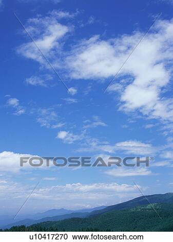 Mountain range and blue sky View Large Photo Image Stock Image - Mountain range and blue sky. Fotosearch