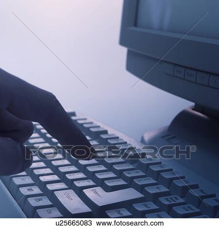 A man using computer View Large Photo Image Stock Image - A man using computer. Fotosearch