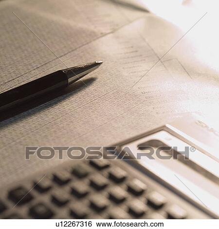 Calculator and pen View Large Photo Image Stock Photograph - Calculator and pen. Fotosearch