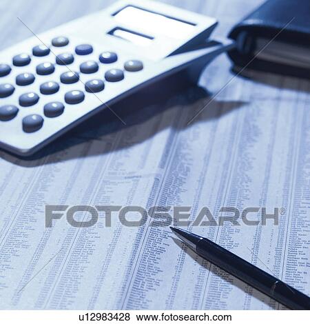 Calculator on newspaper View Large Photo Image Stock Photo - Calculator on newspaper. Fotosearch