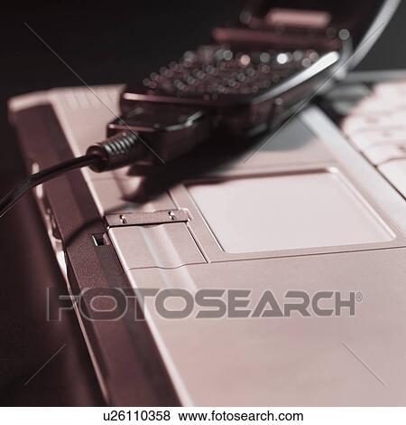 Stock Photo - Computer and mobile phone. Fotosearch