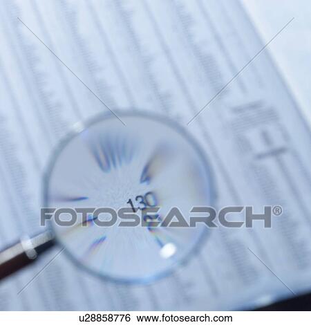 Magnifying glass on newspaper View Large Photo Image Stock Photograph - Magnifying glass on newspaper. Fotosearch