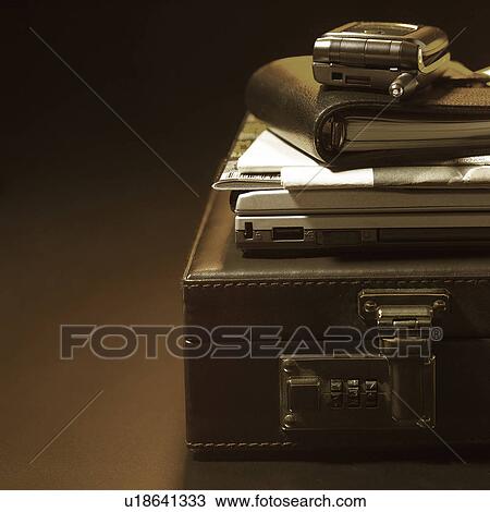 Mobile phone and computer on briefcase View Large Photo Image Stock Image - Mobile phone and computer on briefcase. Fotosearch