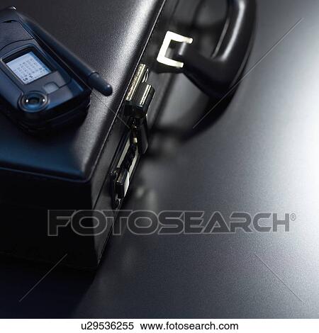 Mobile phone on briefcase View Large Photo Image Stock Photography - Mobile phone on briefcase. Fotosearch