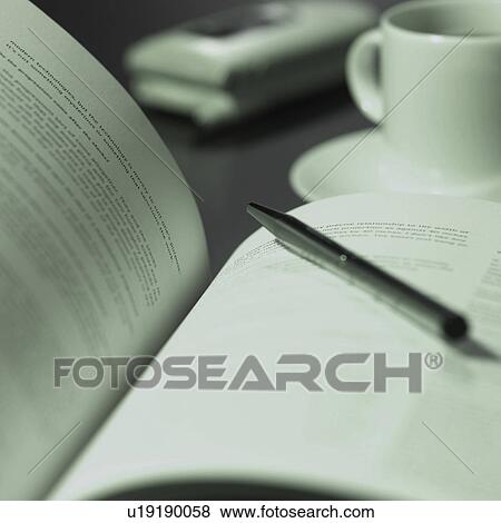 Pen and book, close-up View Large Photo Image Stock Photo - Pen and book, close-up. Fotosearch