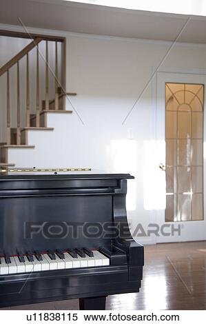 Stock Photography - Piano on wooden floor. Fotosearch