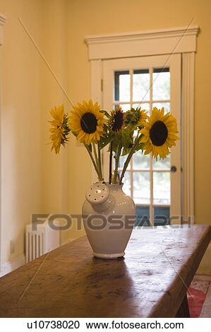 Sunflowers in vase View Large Photo Image Stock Image - Sunflowers in vase. Fotosearch