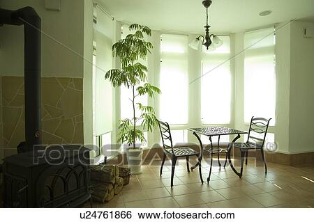 Stock Photograph - Table and chairs in room. Fotosearch