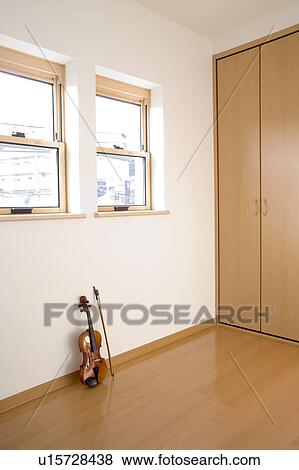 Violin on wooden floor View Large Photo Image Stock Photo - Violin on wooden floor. Fotosearch