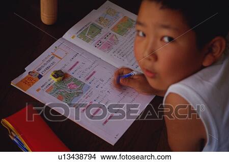 Boy doing homework View Large Photo Image Picture - Boy doing homework. Fotosearch