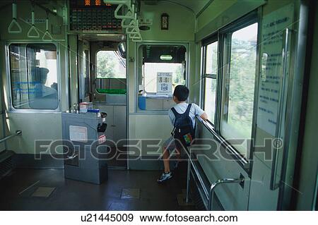 Boy on train View Large Photo Image Stock Photo - Boy on train. Fotosearch