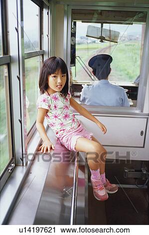 Stock Image - Girl on train. Fotosearch