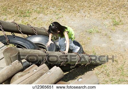 Girl playing in playground View Large Photo Image Stock Image - Girl playing in playground. Fotosearch