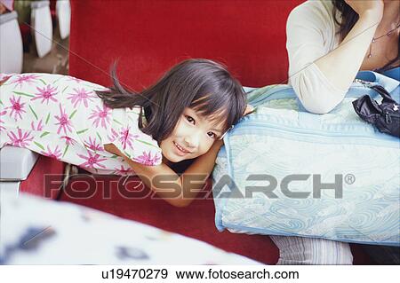 Girl traveling on train with her mother View Large Photo Image Stock Photo - Girl traveling on train with her mother. Fotosearch