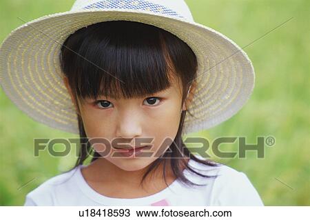 Girl wearing straw hat View Large Photo Image Stock Image - Girl wearing straw hat. Fotosearch