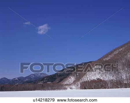 Stock Photo - Snowcapped mountain in Nagano Prefecture, Japan. Fotosearch