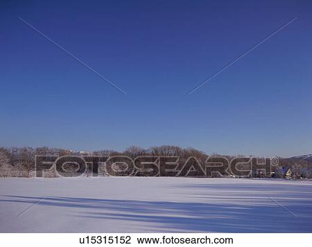 Stock Image - Winter landscape, Hokkaido, Japan. Fotosearch