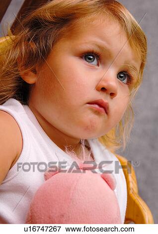 Close-up of a girl with a stuffed toy View Large Photo Image Stock Photo - Close-up of a girl with a stuffed toy. Fotosearch