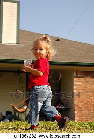 Portrait of a girl holding a disposable glass View Large Photo Image Stock Image - Portrait of a girl holding a disposable glass. Fotosearch