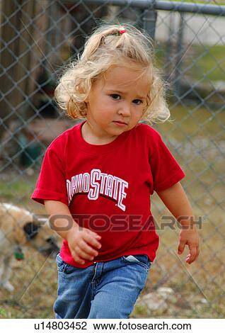 Stock Image - Portrait of a girl walking. Fotosearch