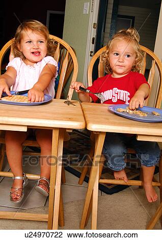 Two girls eating pies View Large Photo Image Stock Image - Two girls eating pies. Fotosearch