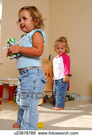 Two girls playing View Large Photo Image Stock Photo - Two girls playing. Fotosearch