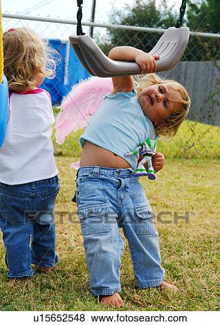 Close-up of two girls playing in a park View Large Photo Image Stock Photo - Close-up of two girls playing in a park. Fotosearch