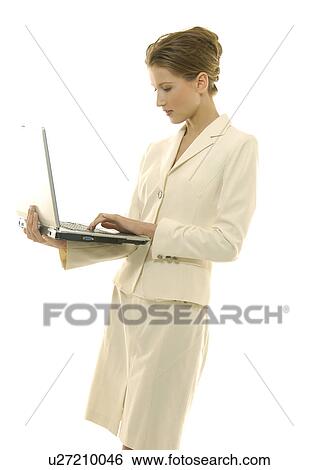 Stock Photograph - Businesswoman working on a laptop. Fotosearch