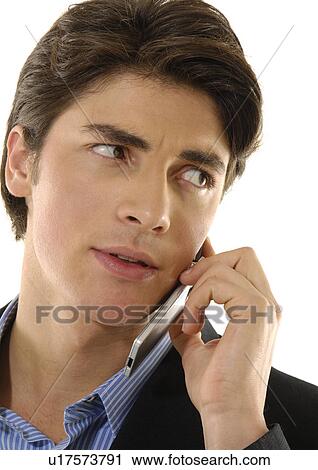 Close-up of a businessman talking on a mobile phone View Large Photo Image Stock Image - Close-up of a businessman talking on a mobile phone. Fotosearch