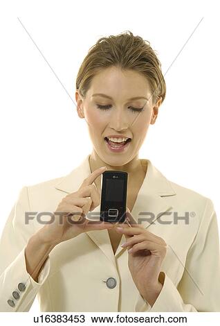 Close-up of a businesswoman showing a mobile phone View Large Photo Image Stock Image - Close-up of a businesswoman showing a mobile phone. Fotosearch