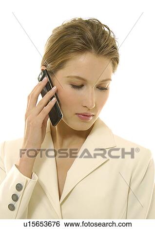 Close-up of a businesswoman talking on a mobile phone View Large Photo Image Stock Photograph - Close-up of a businesswoman talking on a mobile phone. Fotosearch