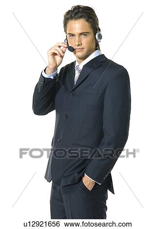 Portrait of a businessman wearing a headset View Large Photo Image Stock Photograph - Portrait of a businessman wearing a headset. Fotosearch