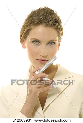 Portrait of a businesswoman holding a mobile phone View Large Photo Image Stock Image - Portrait of a businesswoman holding a mobile phone. Fotosearch