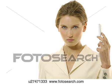 Stock Image - Portrait of a businesswoman holding a mobile phone. Fotosearch