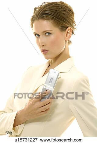 Stock Photo - Portrait of a businesswoman holding a mobile phone. Fotosearch