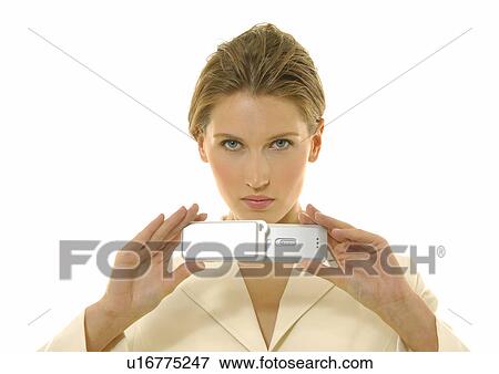 Stock Photo - Portrait of a businesswoman holding a mobile phone. Fotosearch